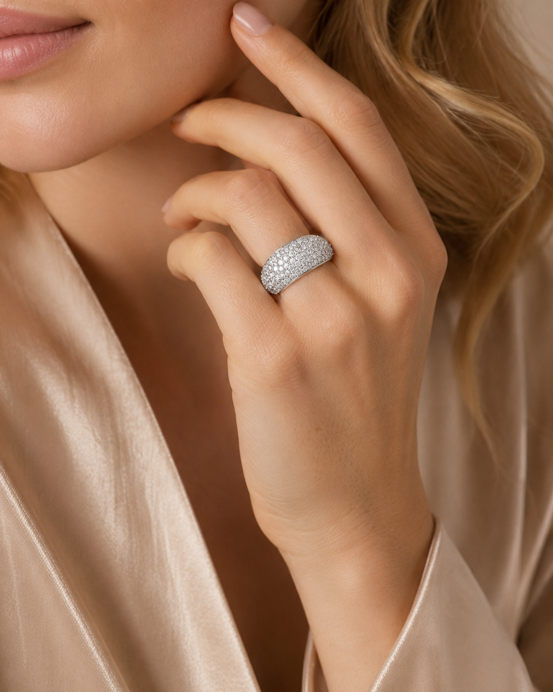 Custom pavé diamond dome ring worn on hand